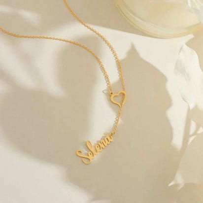 ✨ Personalized Name Necklace with Heart Clasp – Elegant Women’s Jewelry ✨
Add a touch of elegance and meaning to your style with this custom name necklace featuring a unique heart-shaped clasp. Crafted from premium st